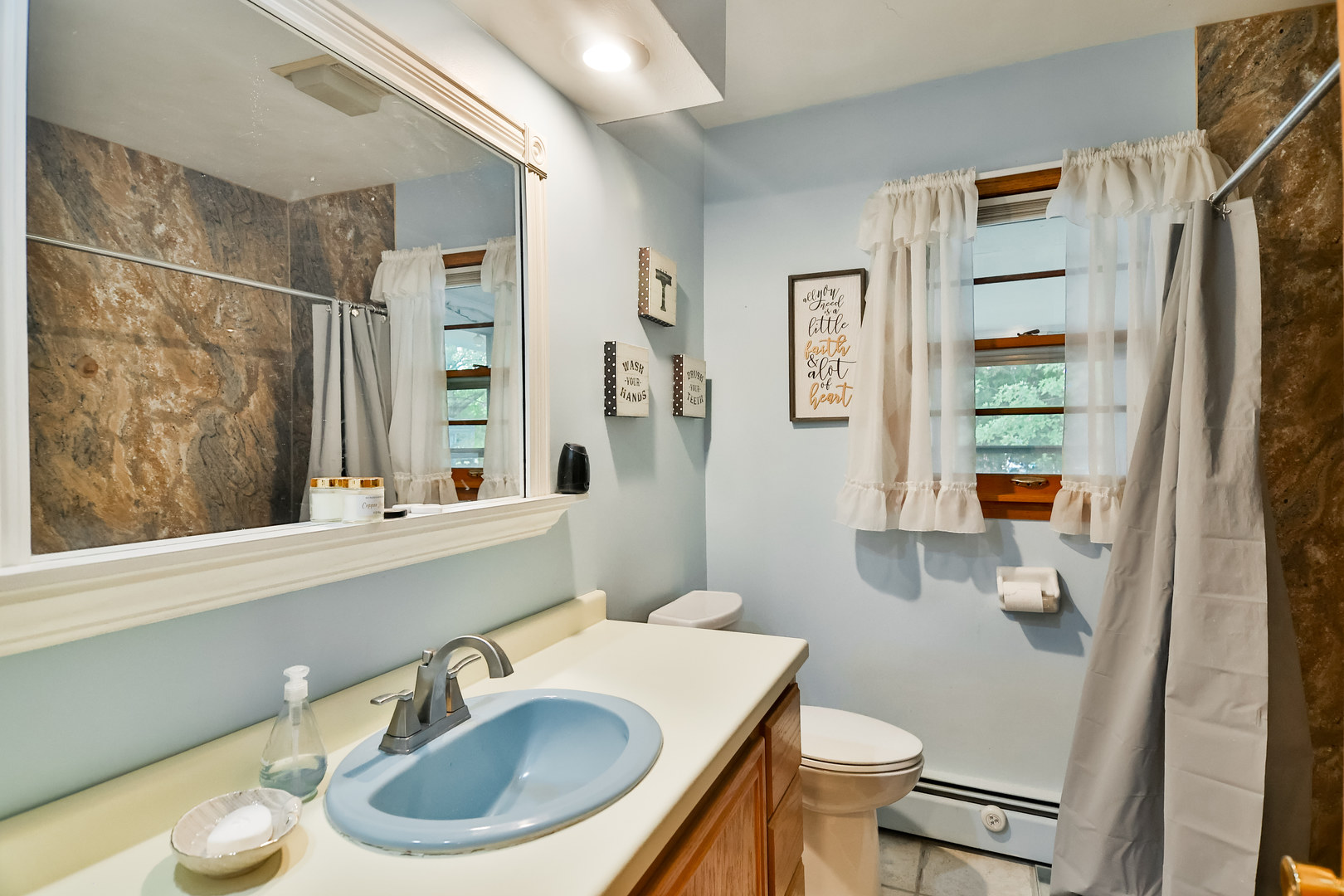3307 Ruth Street Rockford, IL 61103 - Photo 11 of 28 a bathroom with a sink toilet and shower