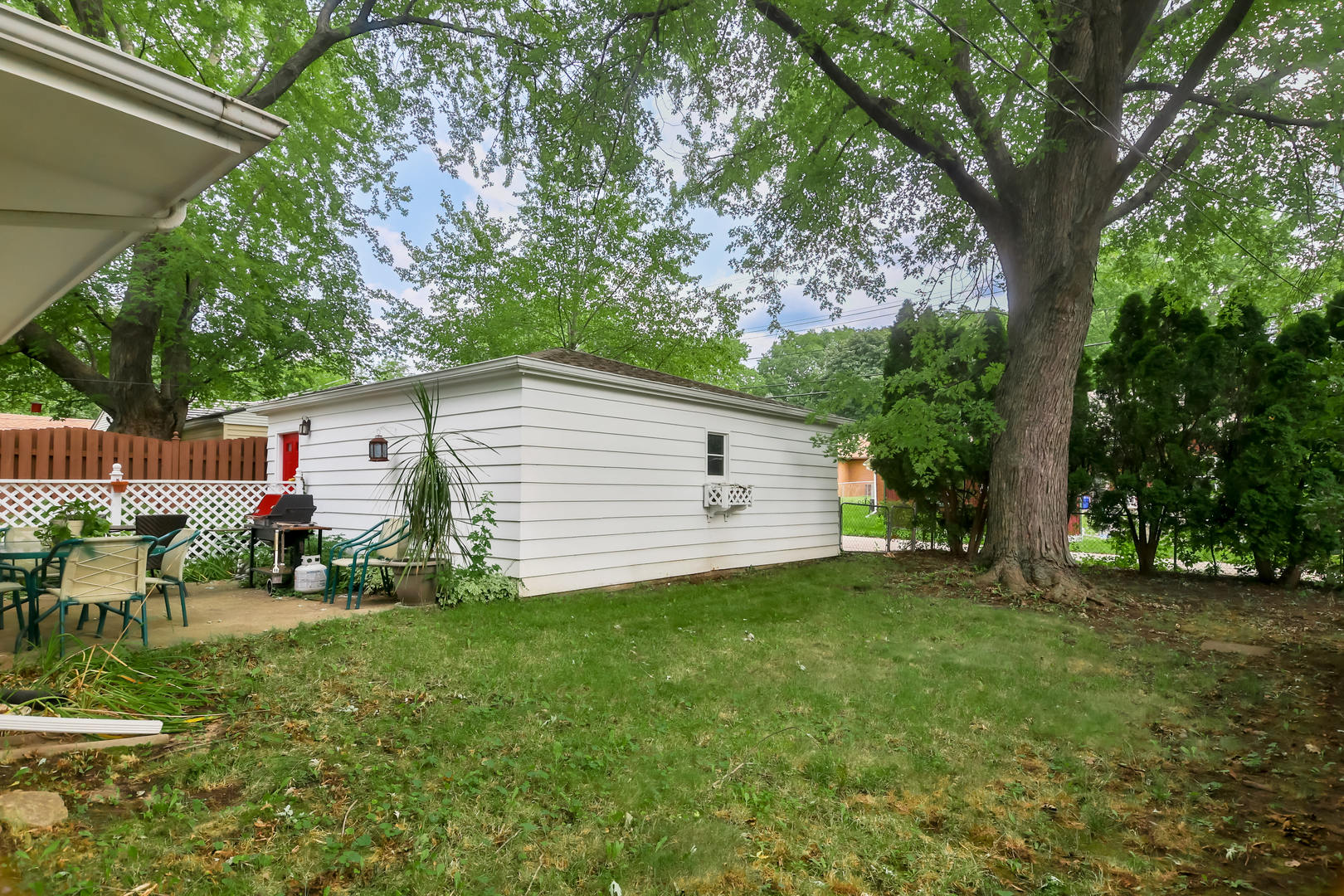 3307 Ruth Street Rockford, IL 61103 - Photo 27 of 28 a view of a house with a yard and sitting area