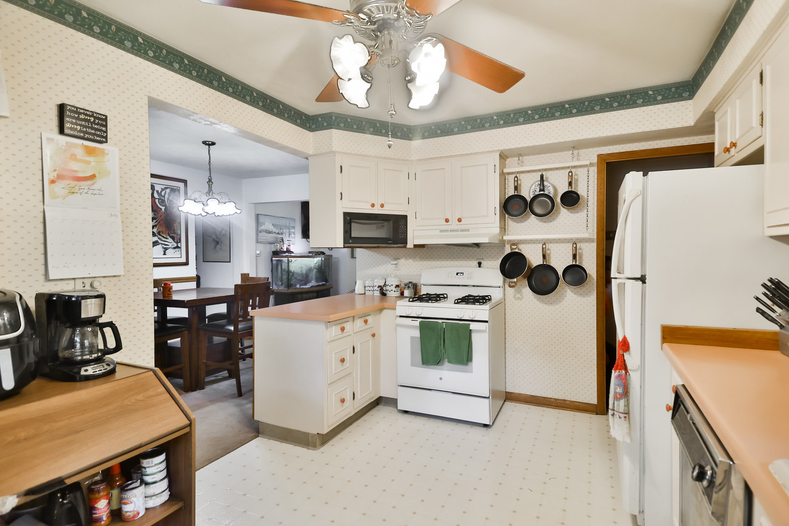 3307 Ruth Street Rockford, IL 61103 - Photo 7 of 28 a kitchen with white cabinets and refrigerator