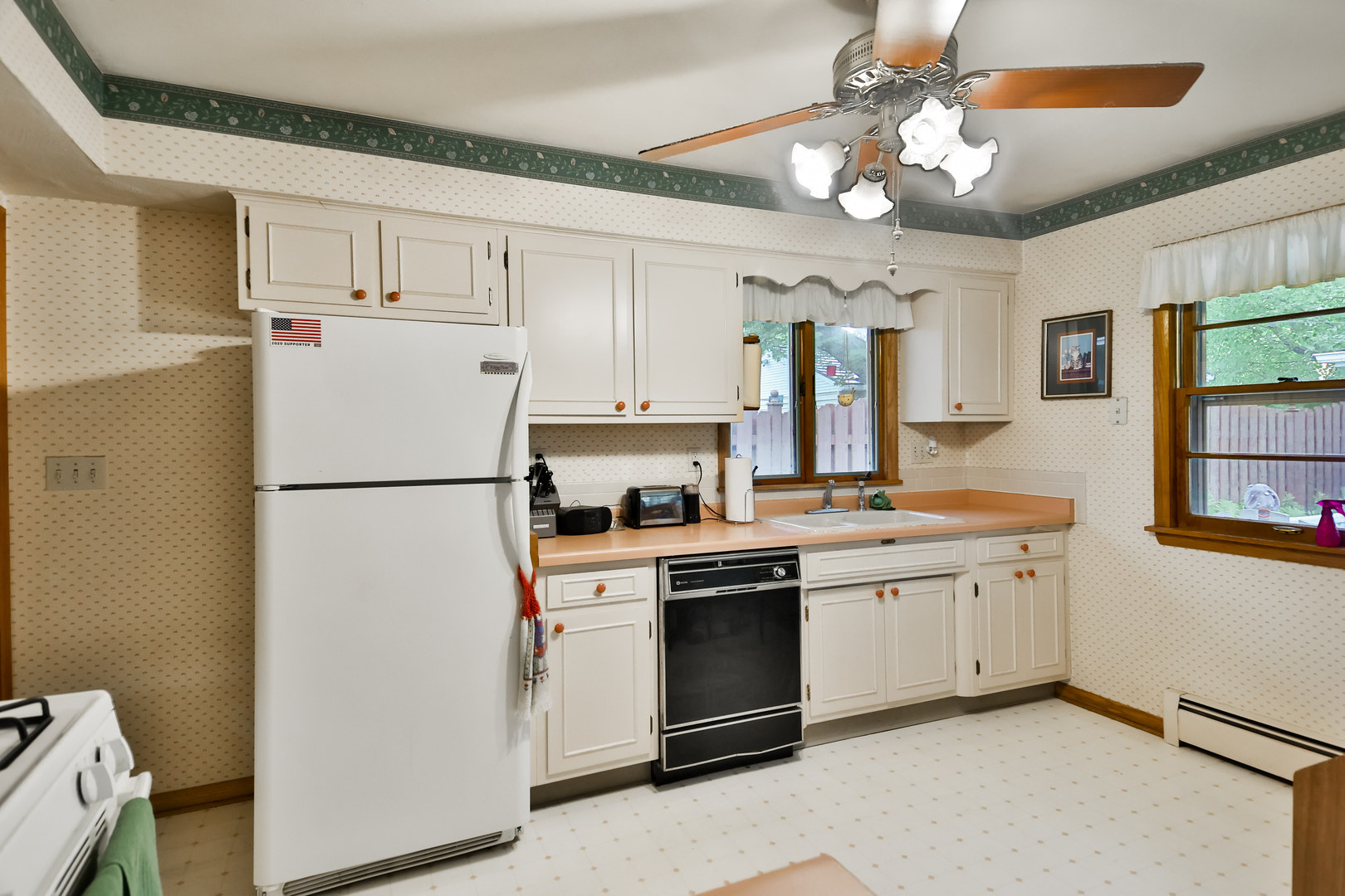 3307 Ruth Street Rockford, IL 61103 - Photo 8 of 28 a kitchen with white cabinets and white appliances