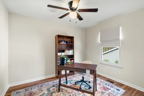 a workspace with furniture and a window