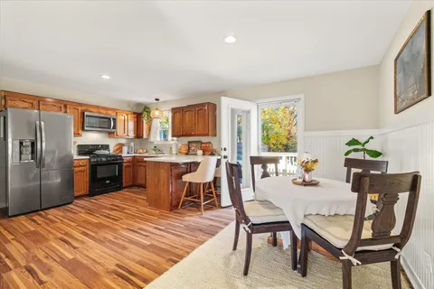 a kitchen with granite countertop lots of counter top space and stainless steel appliances