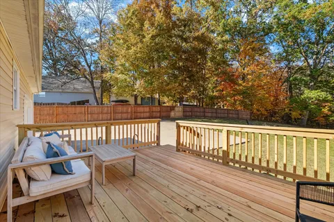 a view of balcony with wooden floor