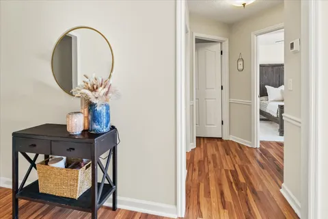 a view of a room that has a table and chairs in it