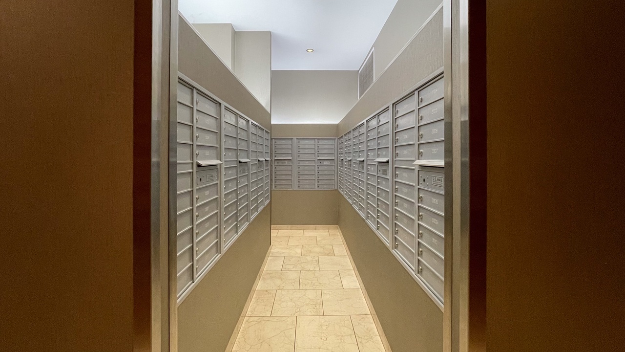 1629 South Prairie Avenue, Unit 2509 Chicago, IL 60616 - Photo 3 of 38 a hallway with wooden floor and brick wall
