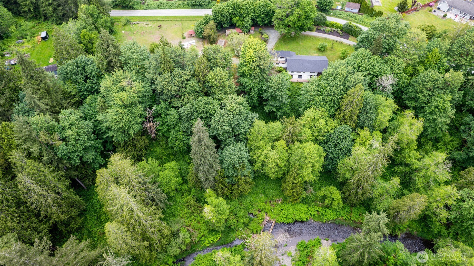 24522 Cromwell Road Monroe, WA 98272 - Photo 33 of 40 an aerial view of a house with pool and yard