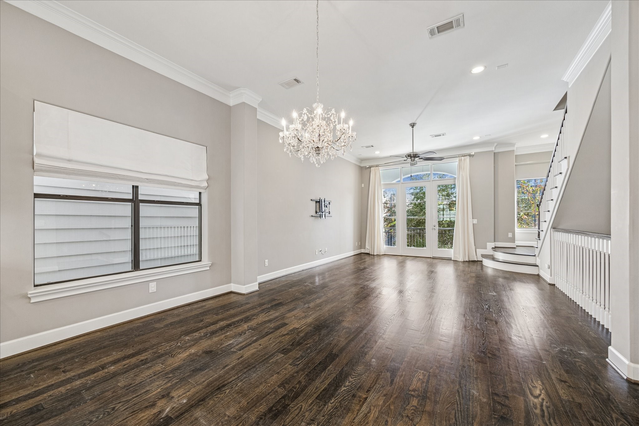 2210 Converse Street Houston, TX 77006 - Photo 12 of 35 a view of an empty room with wooden floor and a window