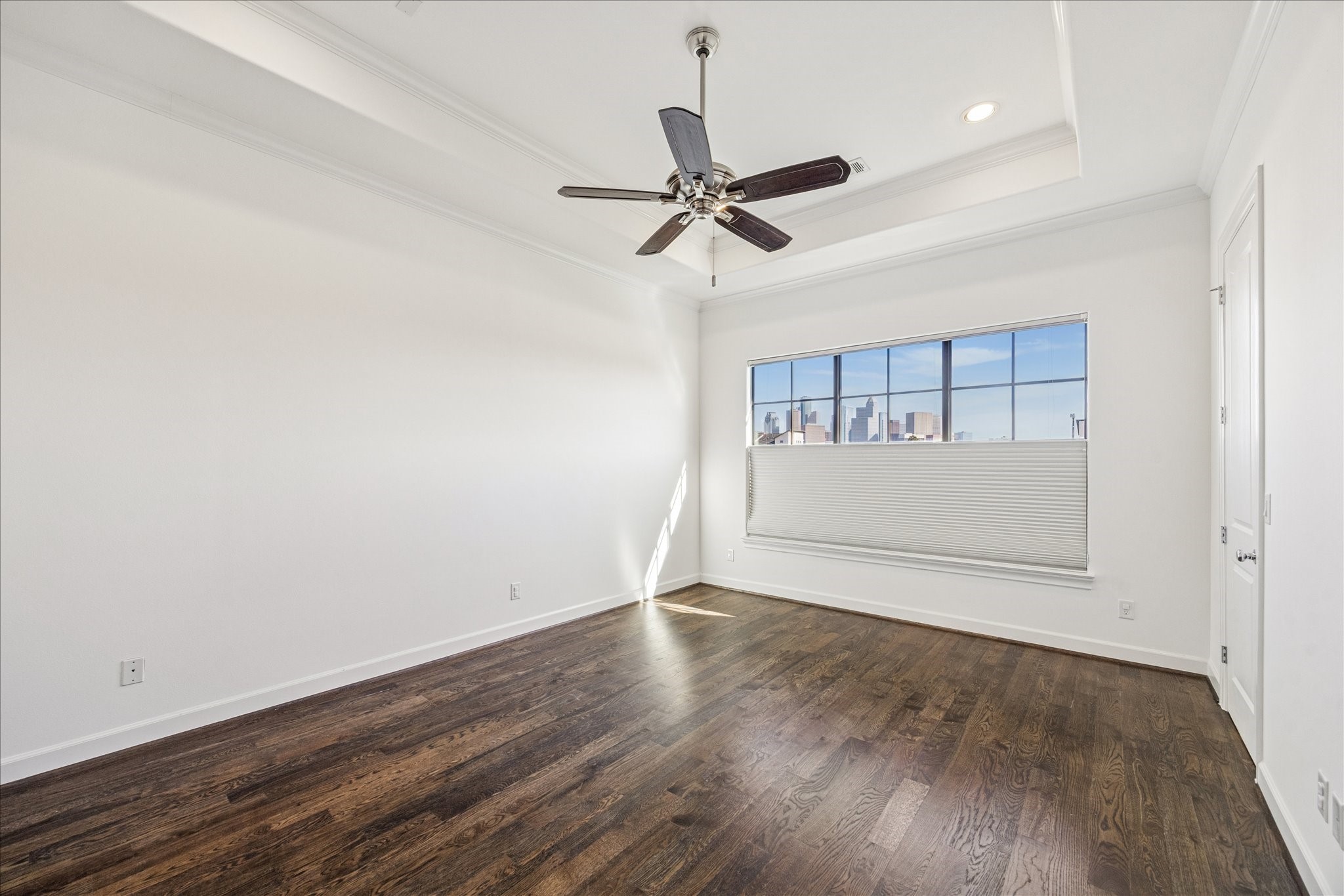 2210 Converse Street Houston, TX 77006 - Photo 17 of 35 an empty room with wooden floor cabinet and windows