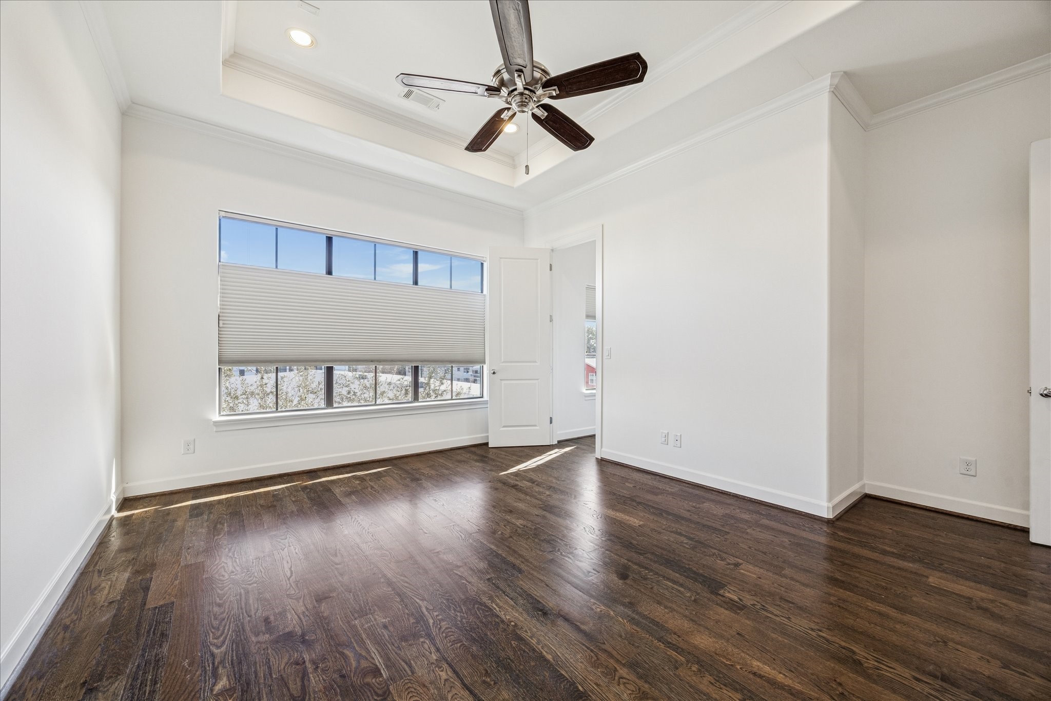 2210 Converse Street Houston, TX 77006 - Photo 19 of 35 a view of an empty room with window and wooden floor