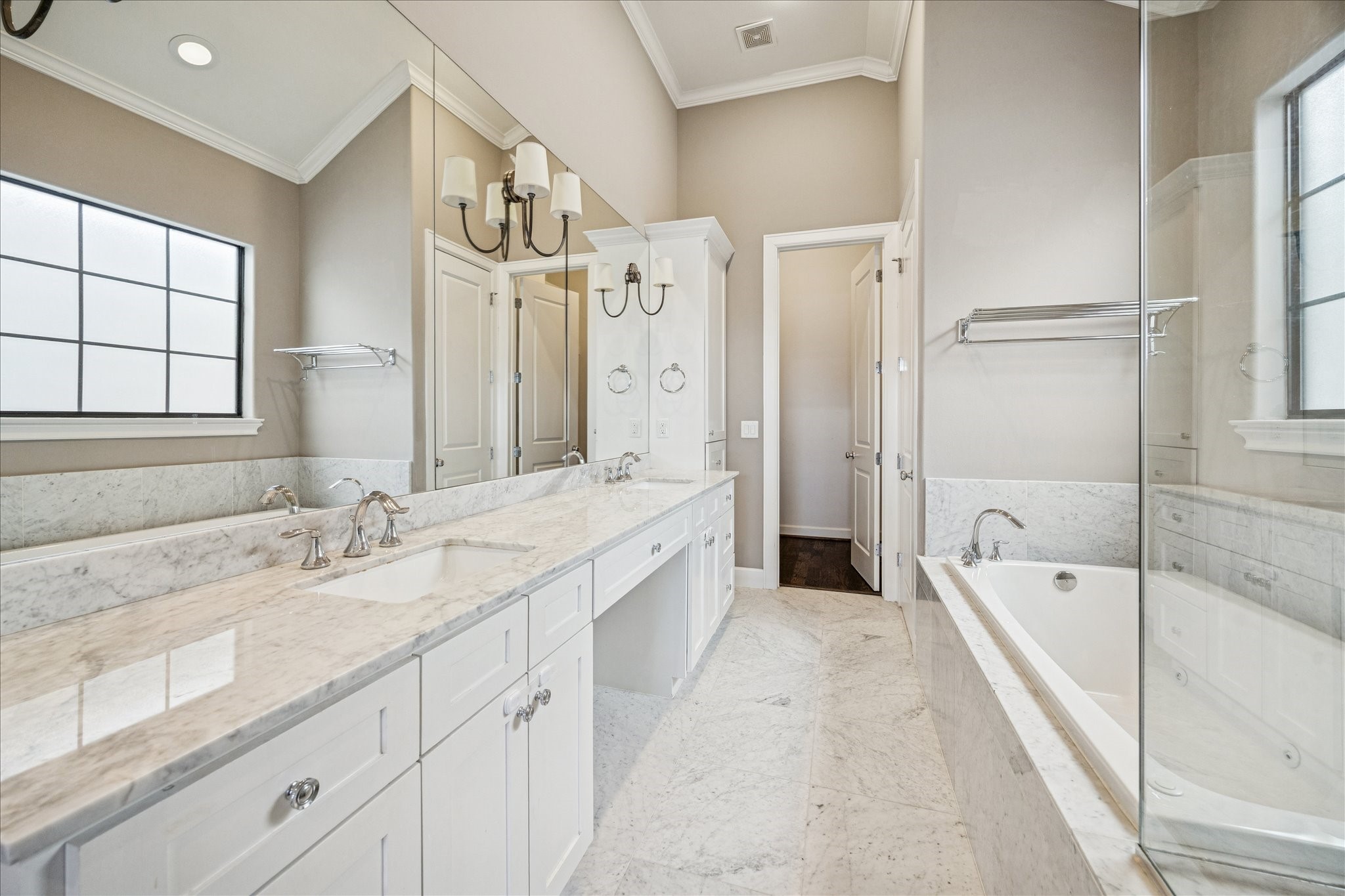 2210 Converse Street Houston, TX 77006 - Photo 20 of 35 The en suite bathroom is absolutely stunning! At the end of the photos is the second of the two closets for the primary suite.