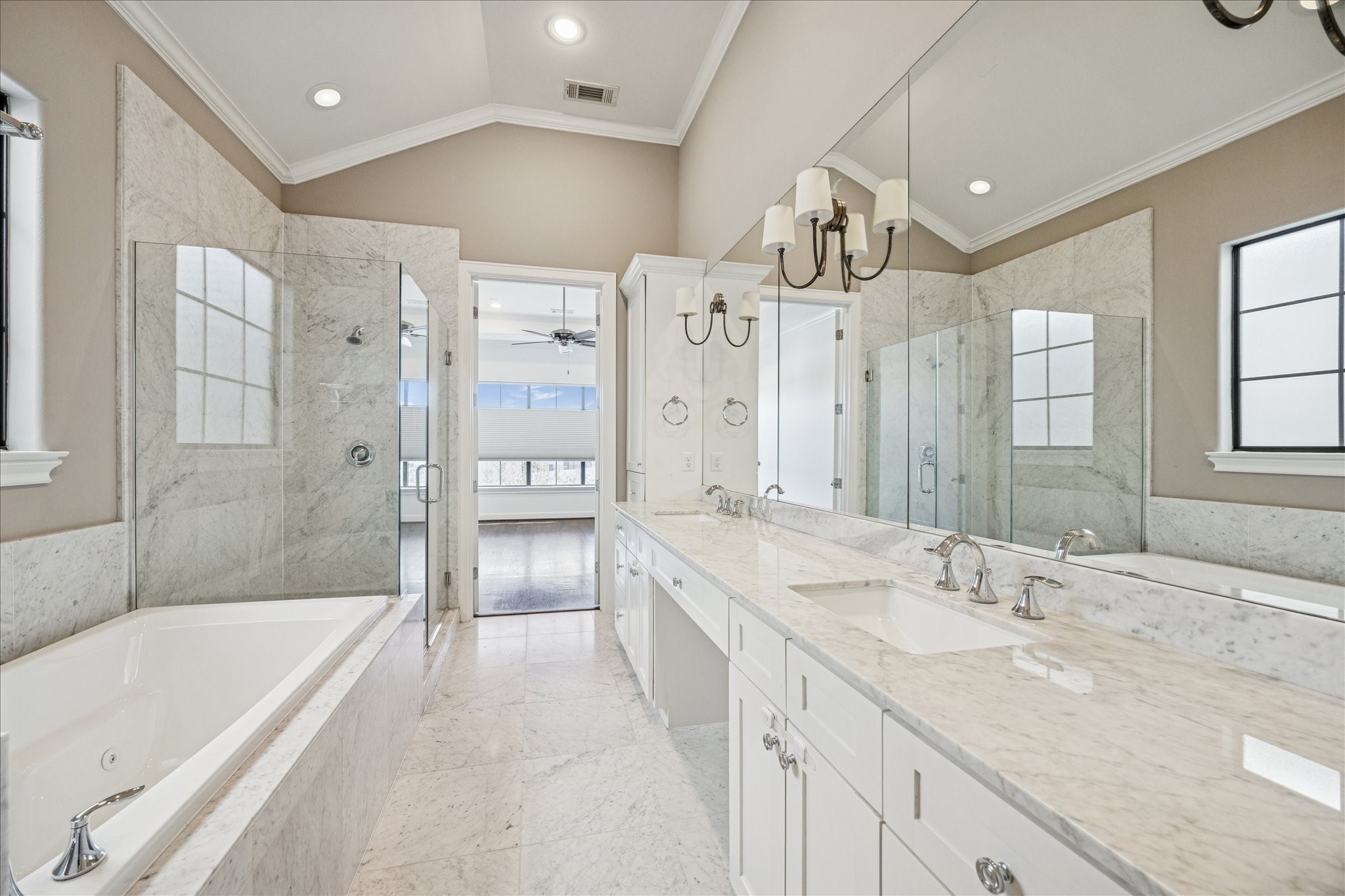 2210 Converse Street Houston, TX 77006 - Photo 22 of 35 a spacious bathroom with a granite countertop sink a mirror a shower and a bathtub