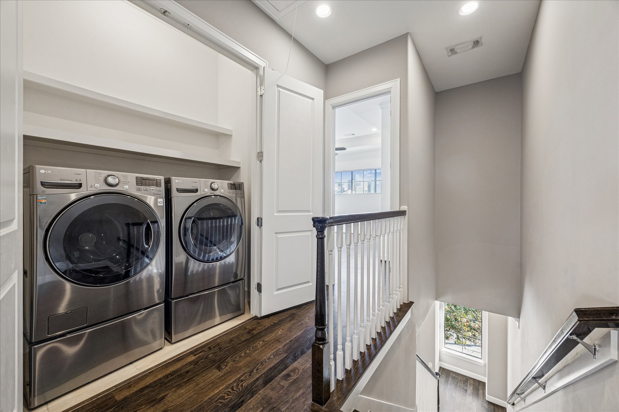 2210 Converse Street Houston, TX 77006 - Photo 26 of 35 a view of a hallway with washer and dryer