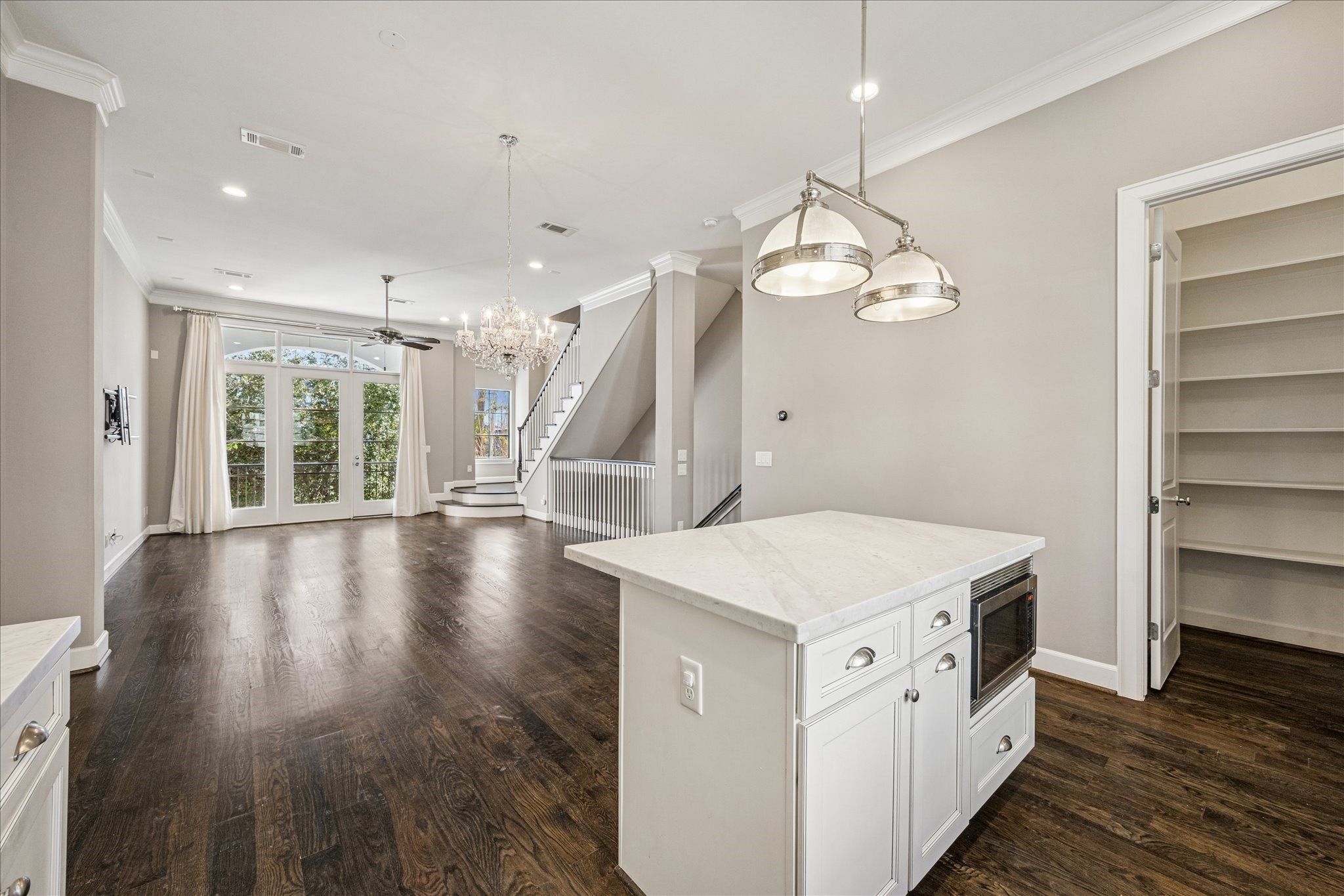 2210 Converse Street Houston, TX 77006 - Photo 10 of 35 a hallway with a large window and wooden floor