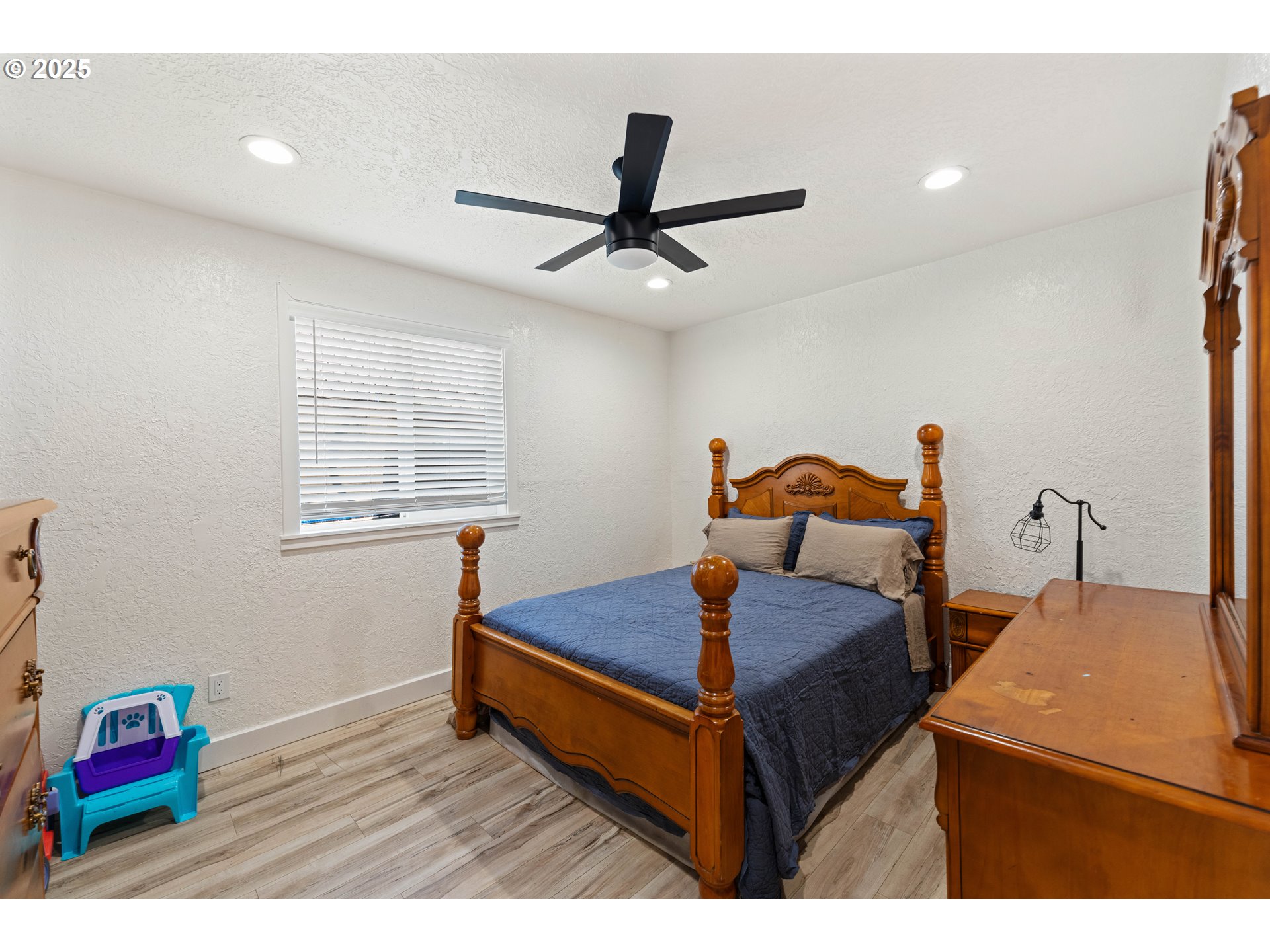 1935 17th Street North Bend, OR 97459 - Photo 20 of 44 a bed room with a bed and a window