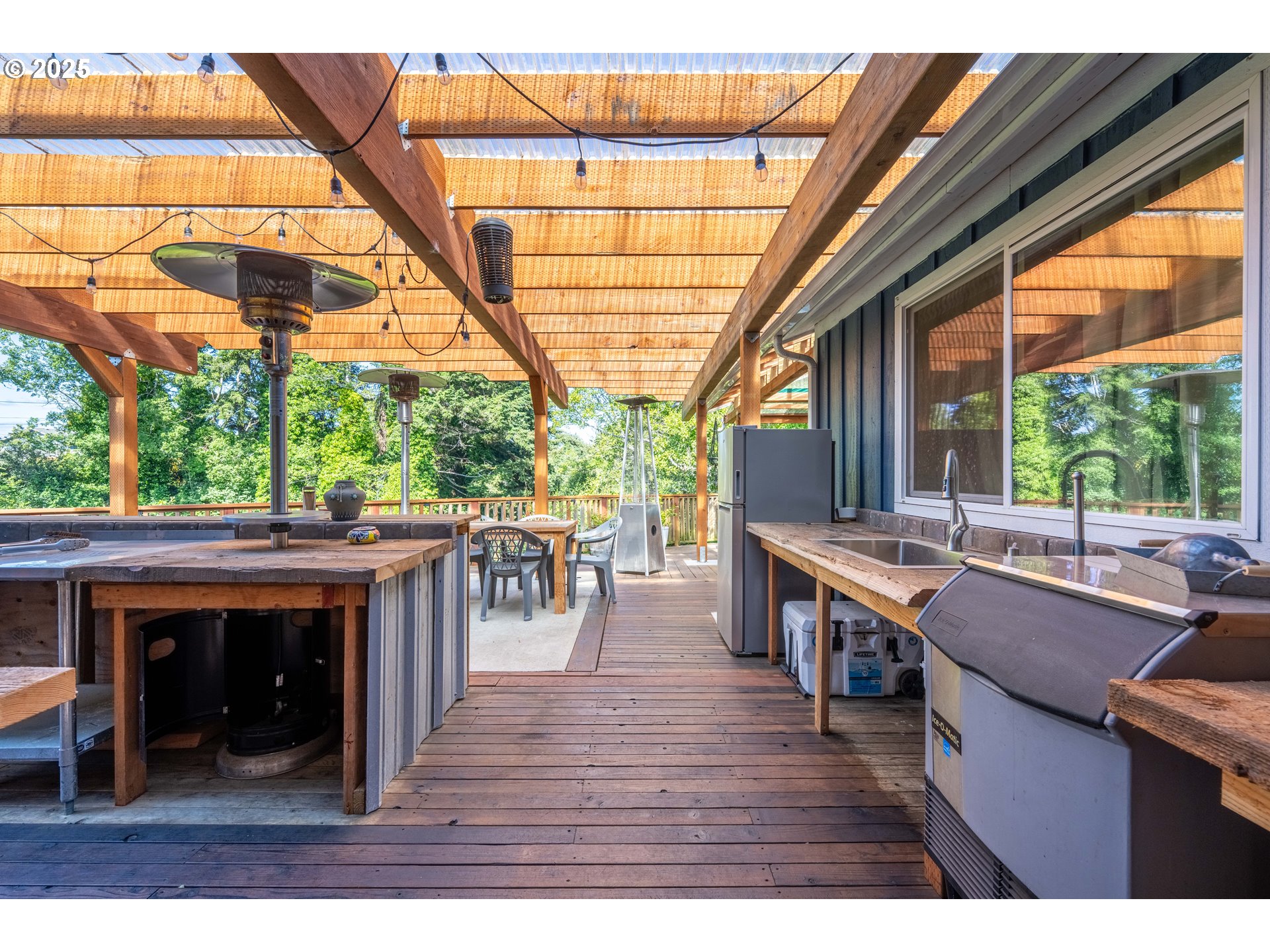 1935 17th Street North Bend, OR 97459 - Photo 22 of 44 a view of a patio with table and chairs