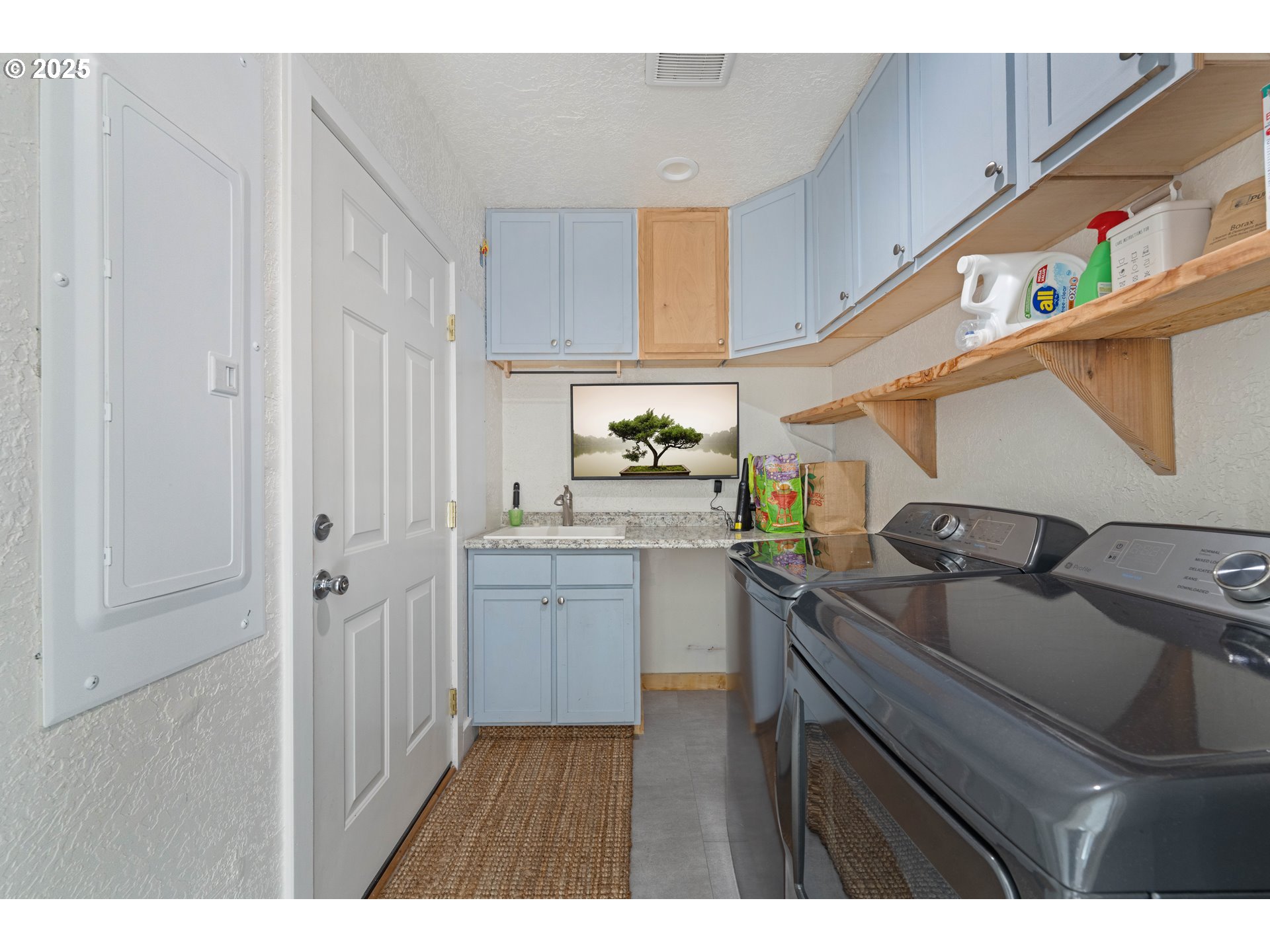 1935 17th Street North Bend, OR 97459 - Photo 27 of 44 a kitchen with a sink and cabinets
