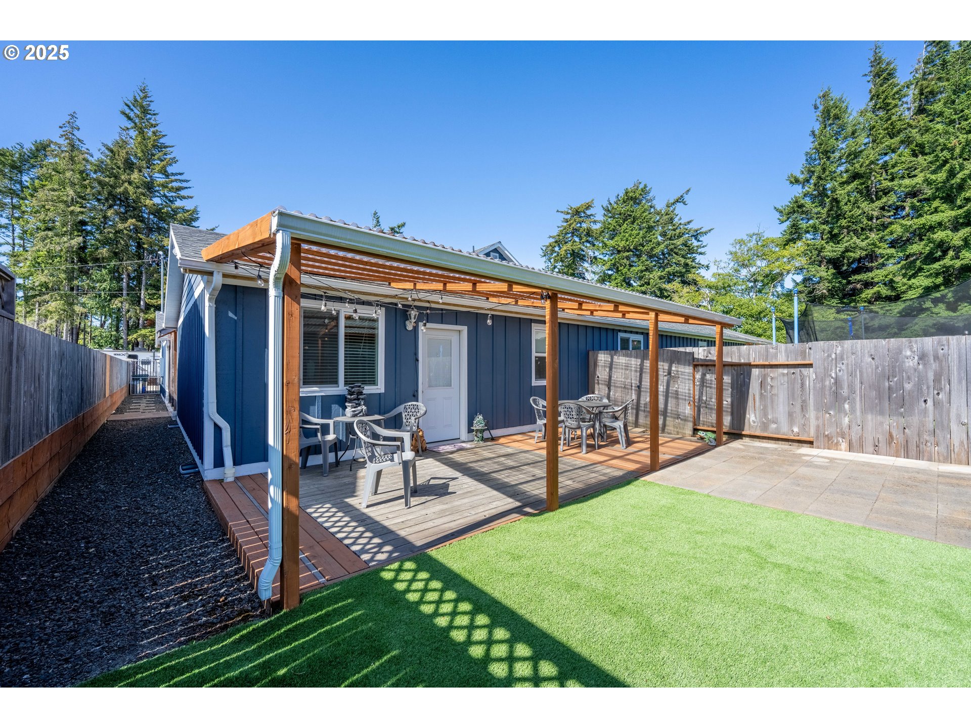 1935 17th Street North Bend, OR 97459 - Photo 37 of 44 a view of a house with backyard and sitting area