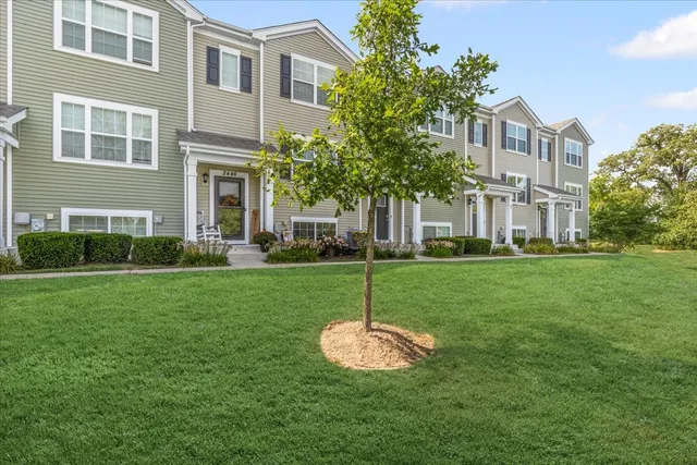 a view of a house with a backyard