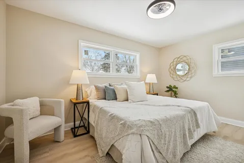 a bedroom with bed and a lamp