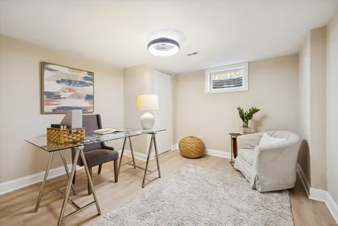 a living room with furniture and a window