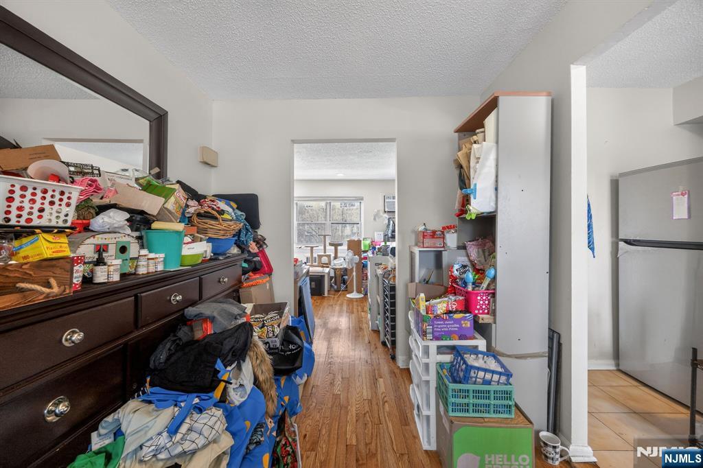 243 Johnson Avenue, Unit L4 Hackensack, NJ 07601 - Photo 14 of 25 a view of a room with lots of stuff and hardwood floor