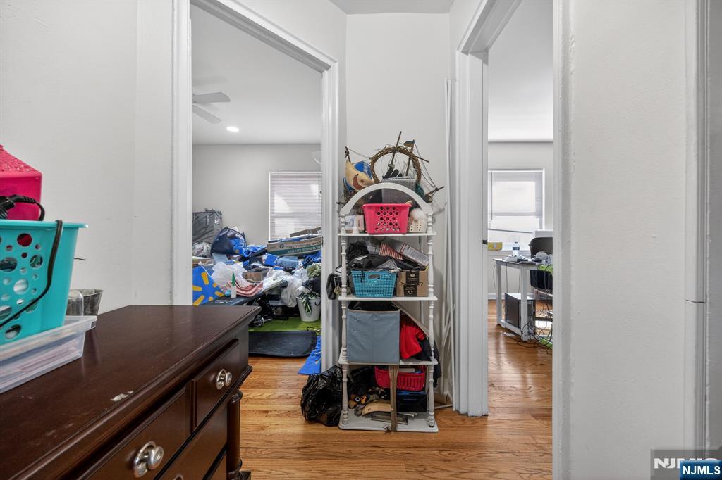 243 Johnson Avenue, Unit L4 Hackensack, NJ 07601 - Photo 15 of 25 a room with furniture and a wooden floor