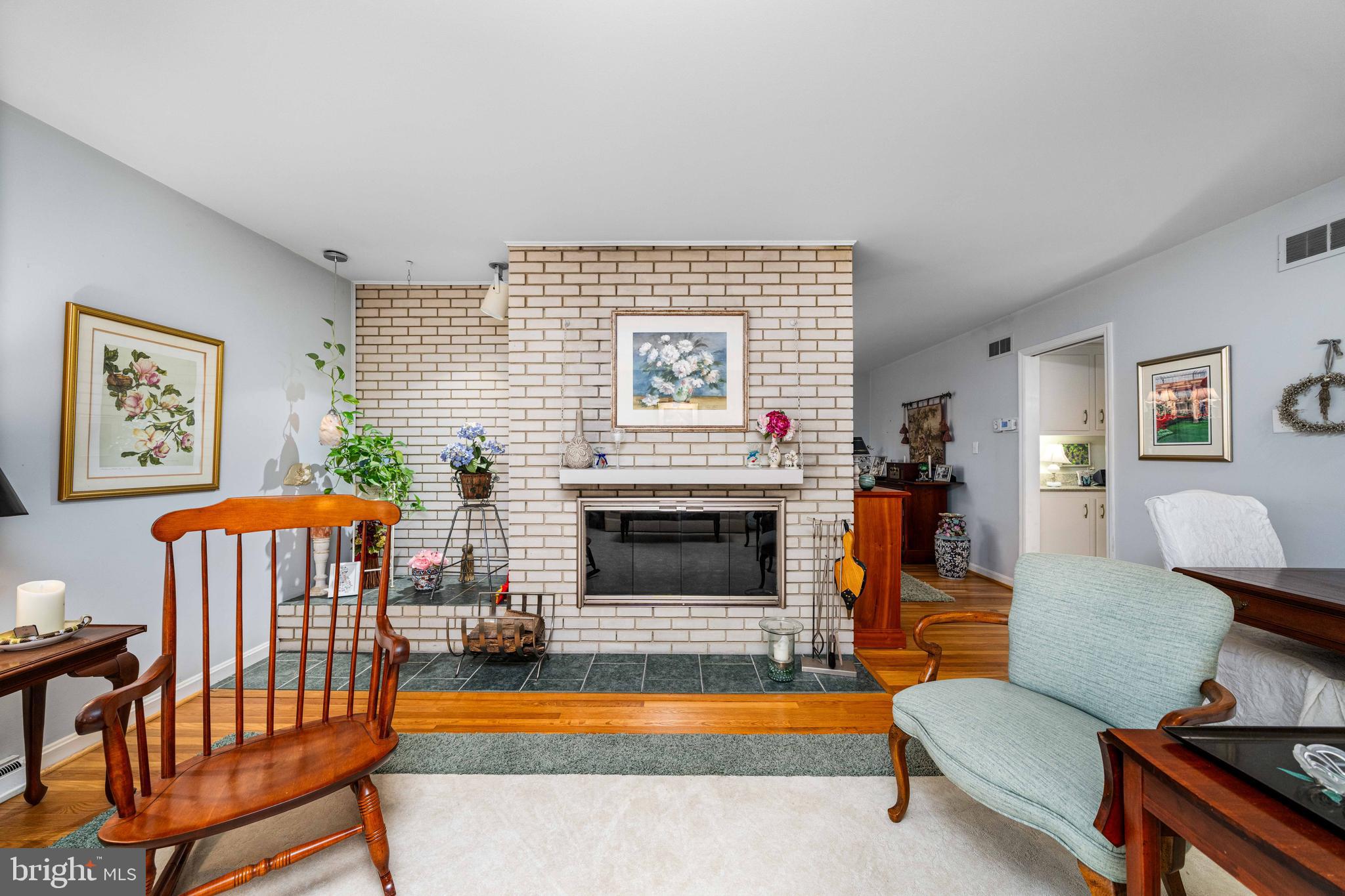 4614 Sylvanus Drive Wilmington, DE 19803 - Photo 14 of 48 a living room with furniture a flat screen tv and a fireplace