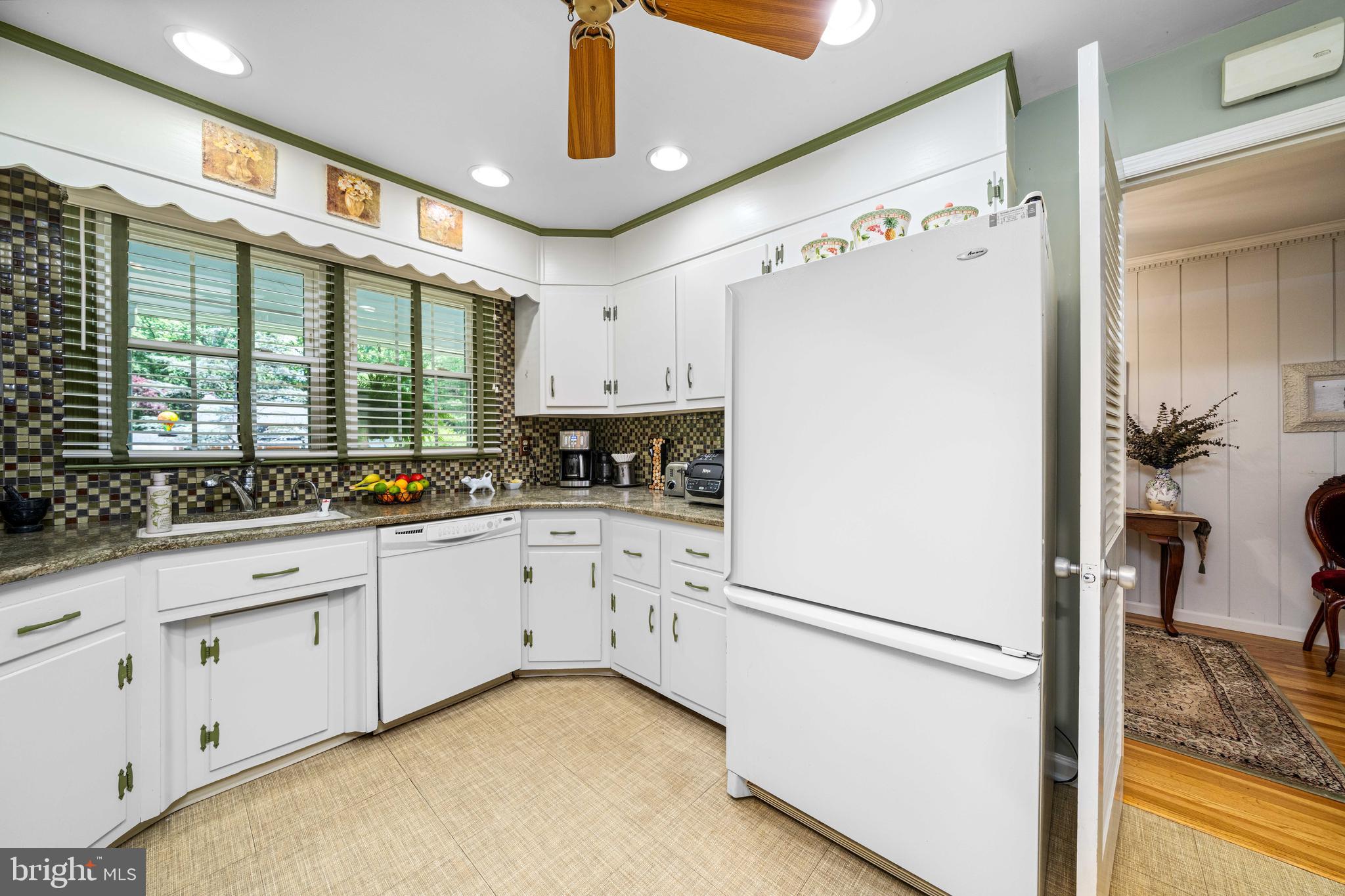 4614 Sylvanus Drive Wilmington, DE 19803 - Photo 16 of 48 a kitchen with white cabinets and white appliances