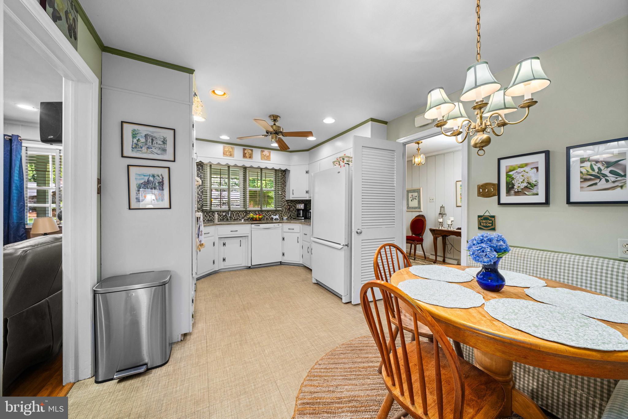 4614 Sylvanus Drive Wilmington, DE 19803 - Photo 17 of 48 a kitchen with stainless steel appliances granite countertop a sink a stove a refrigerator a dining table and chairs