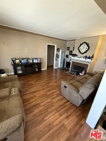a view of a house with a wooden fence
