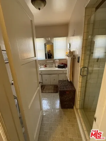 a bathroom with a sink a vanity and a mirror