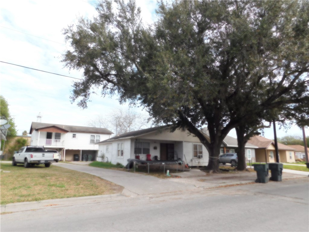 409 Chaparral Street Alice, TX 78332 - Photo 9 of 24 a front view of a house with a yard