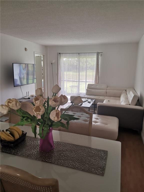 9449 Boca Cove Circle, Unit 908 Boca Raton, FL 33428 - Photo 3 of 12 a living room with furniture and a window