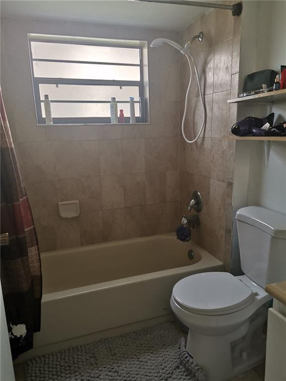 9449 Boca Cove Circle, Unit 908 Boca Raton, FL 33428 - Photo 8 of 12 a bathroom with a toilet and a shower