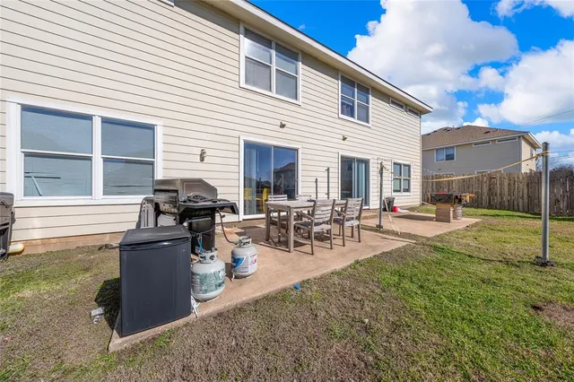 a view of a backyard with sitting area