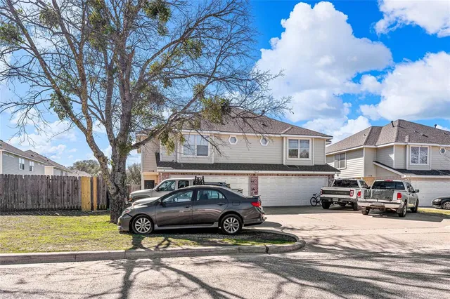 a car parked in front of a house