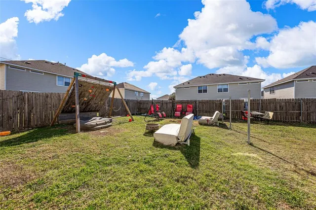 a view of a house with backyard porch and sitting area