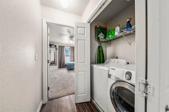 a view of a hallway with washer and dryer