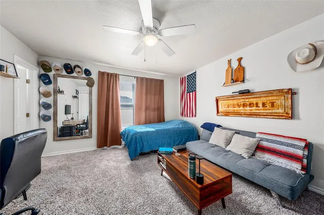 a living room with furniture and a rug