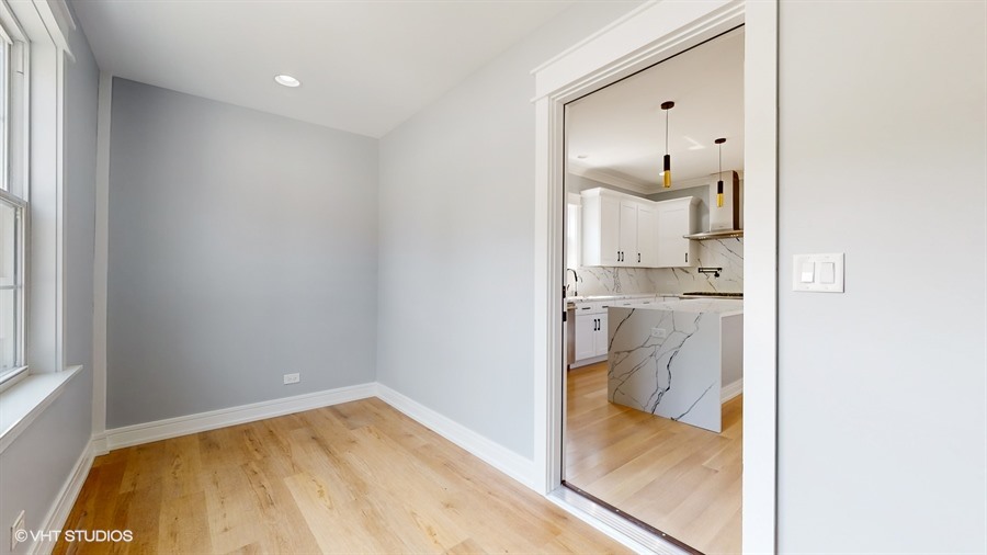 4115 North Ridgeway Avenue Chicago, IL 60618 - Photo 14 of 46 a bathroom with a sink and a mirror
