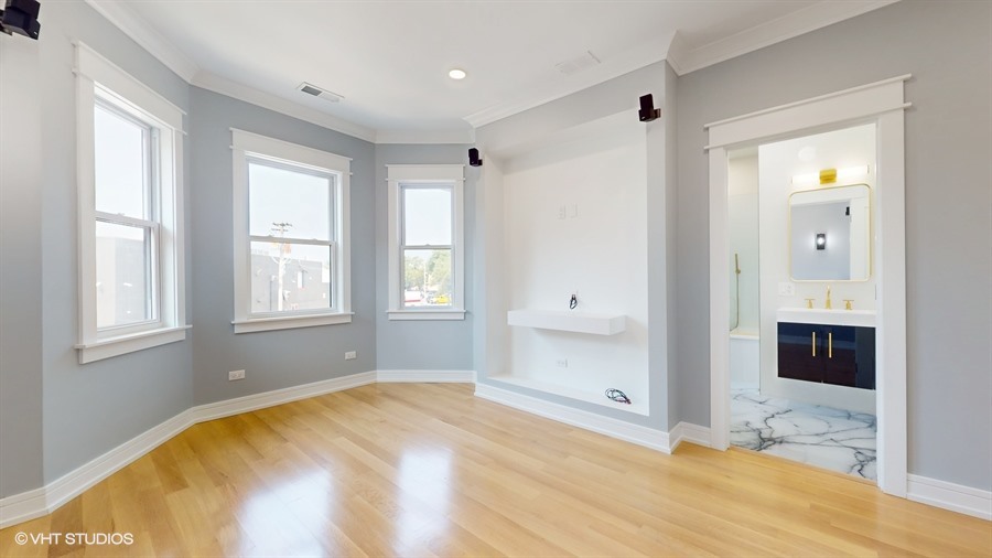 4115 North Ridgeway Avenue Chicago, IL 60618 - Photo 16 of 46 a view of empty room with window and fireplace