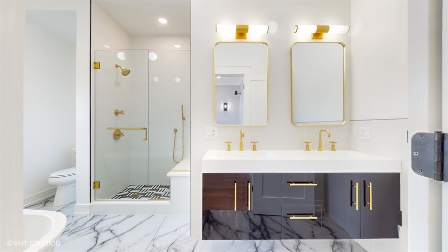 4115 North Ridgeway Avenue Chicago, IL 60618 - Photo 18 of 46 a bathroom with a sink a toilet and shower