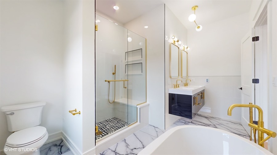 4115 North Ridgeway Avenue Chicago, IL 60618 - Photo 19 of 46 a bathroom with a sink a toilet and shower