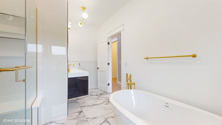 4115 North Ridgeway Avenue Chicago, IL 60618 - Photo 20 of 46 a bathroom with a tub shower and sink