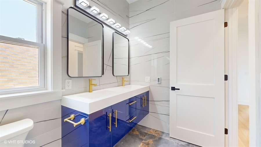 4115 North Ridgeway Avenue Chicago, IL 60618 - Photo 25 of 46 a bathroom with a double vanity sink mirror and