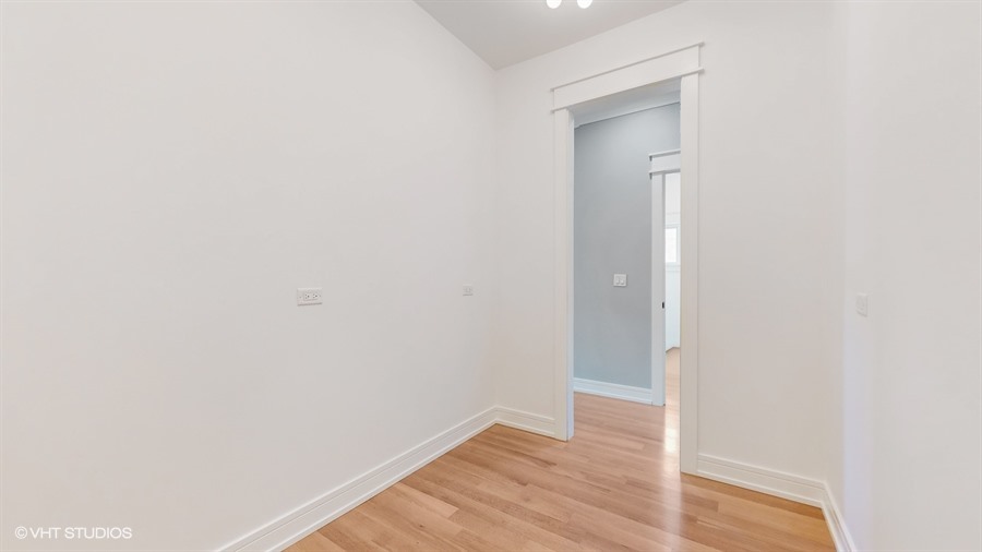 4115 North Ridgeway Avenue Chicago, IL 60618 - Photo 27 of 46 a view of an empty room with wooden floor
