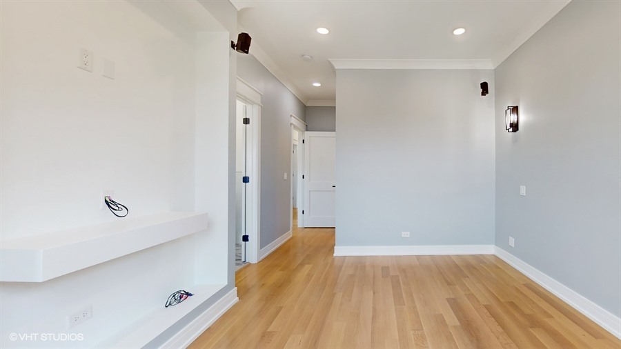 4115 North Ridgeway Avenue Chicago, IL 60618 - Photo 28 of 46 wooden floor in an empty room with a window