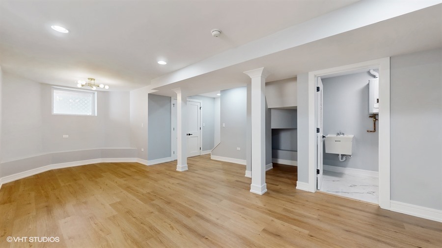 4115 North Ridgeway Avenue Chicago, IL 60618 - Photo 35 of 46 a view of empty room with wooden floor and window