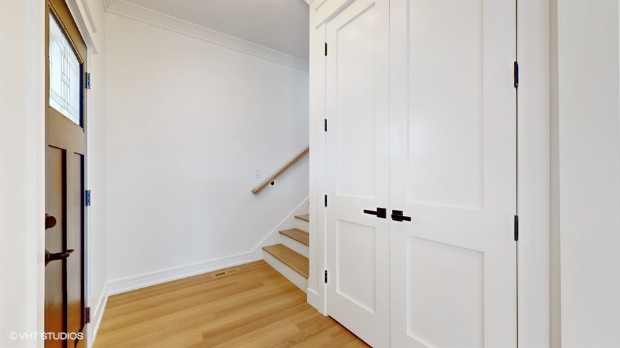 4115 North Ridgeway Avenue Chicago, IL 60618 - Photo 5 of 46 a view of a hallway with staircase