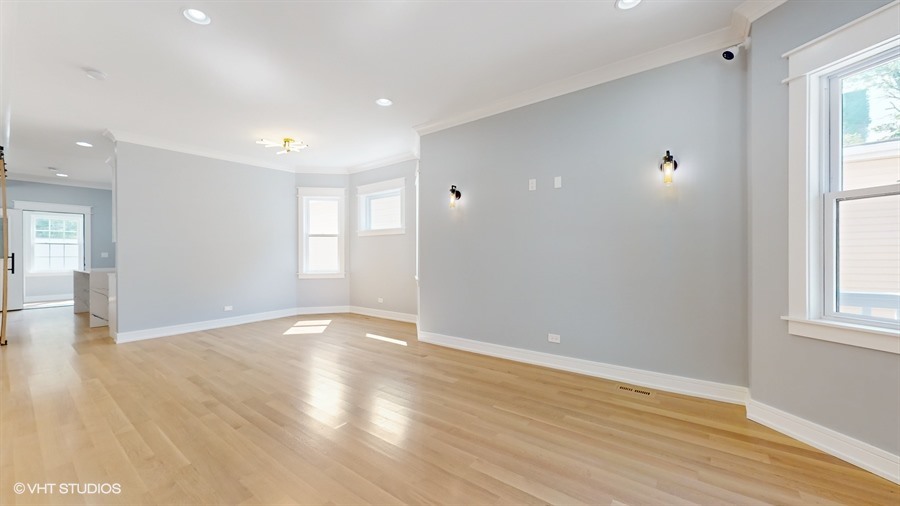 4115 North Ridgeway Avenue Chicago, IL 60618 - Photo 6 of 46 wooden floor in an empty room with a window